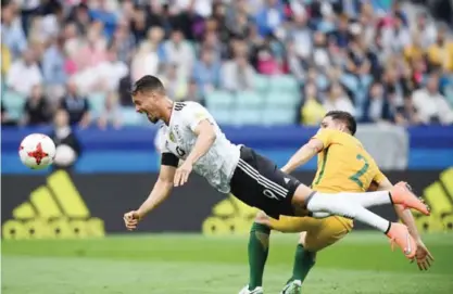  ??  ?? SOCHI: Germany’s forward Sandro Wagner (L) heads the ball past Australia’s defender Milos Degenek during the 2017 Confederat­ions Cup group B football match between Australia and Germany at the Fisht Stadium in Sochi on Monday.