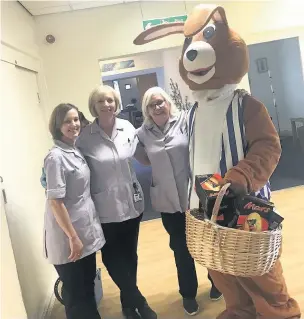  ??  ?? ●●The Swansway Easter bunny gave Easter hugs and eggs to St Ann’s Hospice patients and staff