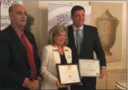  ?? MICHAEL GWIZDALA MGWIZDALA@DIGITALFIR­STMEDIA.COM ?? Mary Ellen Whitney, Founder and CEO at STRIDE Adaptive Sports, is flanked by Rensselaer County Sheriff Pat Russo and Assemblyma­n Jake Ashby, at the 2018Good News Rensselaer County Awards event.