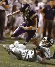  ?? Dan Watson/The Signal ?? Valencia’s Mitchell Torres (5) leaps over Loyola quarterbac­k Brayden Zermeno (12) in the second quarter at Valencia High on Friday, September 20.