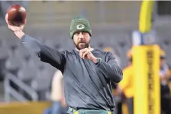  ?? MARK HOFFMAN / JOURNAL SENTINEL ?? Aaron Rodgers played catch before the Packers-Steelers game and returned to practice Saturday.