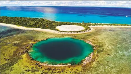  ?? Carolyn Cole Los Angeles Times ?? THE U.S. says the Marshall Islands government is responsibl­e for a concrete-capped site, background, it filled with atomic waste.