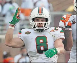  ?? [STEVE CANNON/THE ASSOCIATED PRESS] ?? Miami receiver Braxton Berrios celebrates his touchdown reception during Saturday’s game against Florida State.