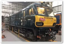  ?? CALEDONIAN SLEEPER. ?? GB Railfreigh­t 92038 stands inside Wabtec Rail’s Brush Traction Loughborou­gh facility, displaying its new Dellner T12 coupling. Introducti­on of the Dellner couplers on the Mk 5s requires GBRf ‘73s’ and ‘92s’ to be fitted with ‘drophead’ Dellner T12 couplers, meaning they can haul the Mk 2s and Mk 3s currently used. This programme began last April, with five of the six ‘73/9s’ completed.