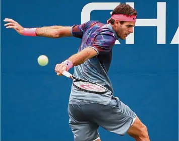  ??  ?? Smooth sailing: Juan Martin del Potro of Argentina hitting a backhand against Roberto Bautista Agut of Spain in the third round on Saturday. — Reuters