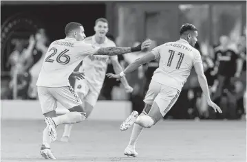  ?? MATIAS J. OCNER mocner@miamiheral­d.com ?? Inter Miami forward Ariel Lassiter celebrates with midfielder Gregore Silva after scoring a first-half goal against the New York Red Bulls on Sunday night at DRV PNK Stadium in Fort Lauderdale.