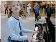  ?? ?? Crowd pleaser: Playing at Leeds station