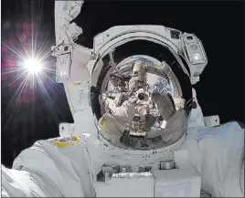  ?? NASA ?? Astronaut Aki Hoshide takes a self-portrait while outside the Internatio­nal Space Station.