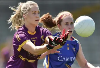  ??  ?? Georgina Hearn of Wexford gets to the ball ahead of Tipperary’s Niamh Lonergan.