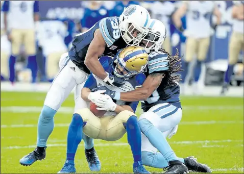  ?? THE CANADIAN PRESS ?? Wide receiver Weston Dressler (centre) inked a one-year deal to stay with the Blue Bombers.