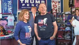  ?? TOM TINGLE/THE REPUBLIC ?? Karen MacKean and Steve Slaton, shown on Sept. 28, are co-owners of The Trumped Store and Coffee House in Show Low. They sell all things Trump.