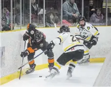  ?? BOB TYMCZYSZYN ST. CATHARINES STANDARD FILE PHOTO ?? Fort Erie’s Cameron Robillard, left, battles Caledonia’s Noah Baltzer for the puck in action earlier this season. Caledonia has home-ice advantage in a best-of-seven Golden Horseshoe Conference final versus Fort Erie starting Wednesday.