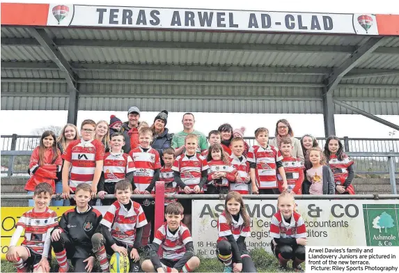  ?? ?? Arwel Davies’s family and Llandovery Juniors are pictured in front of the new terrace. Picture: Riley Sports Photograph­y