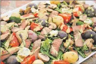  ??  ?? AP PHOTO A meat and potatoes steakhouse salad from a recipe by Melissa d’arabian.