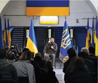  ?? ?? THE HARD TRUTHS Left: Zelensky at an April press conference. Opposite: Lysychansk was subject to unrelentin­g bombardmen­t in June. A destroyed school (top) and the rubble of a police station (bottom).