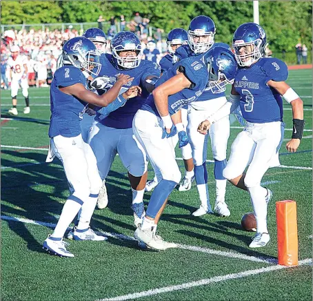  ?? Photos by Ernest A. Brown ?? Shane Meerbott (16, above) celebrates after catching one of Cumberland senior quarterbac­k Dante Aviles-Santos’ (3) four touchdown passes in Friday evening’s 30-21 Division I victory over East Providence. Isaiah Cole (2, below) caught two touchdown passes and rushed for 58 yards.