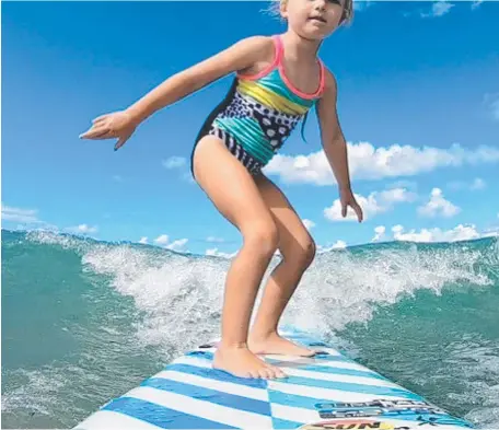  ??  ?? Kalanni Hurrey is a five-year-old Gold Coast surfing sensation.