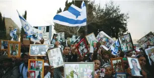  ?? (Reuters) ?? ETHIOPIAN-ISRAELIS call on the government in March to bring the remaining members of their community living in Ethiopia, known as Falash Mura, to Israel.