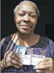  ?? CARRIE ANTLFINGER / AP ?? Gladys Harris of Milwaukee holds some of the forms of identifica­tion she brought with her to the polls in the 2016 presidenti­al election. She was unable to vote because she had lost her driver’s license a few days before and thought one of the many...