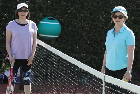  ??  ?? Cathriona Campbell and Cathriona Leydon back in action as Laytown & Bettystown Tennis Club reopened last week and (left) Bobby Brady concentrat­es on the ball.