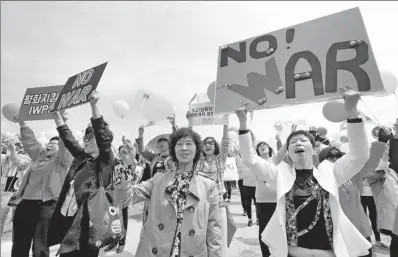  ?? AHN YOUNG-JOON / ASSOCIATED PRESS ?? Peace activists stage a rally to support the upcoming summit between inter-Korean leaders at the Imjingak Pavilion in Paju, the Republic of Korea, on Thursday.