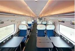  ?? Avanti West Coast ?? The interior of a First Class coach on the refurbishe­d 390125. The coach features wireless charging points built into the tables, while power sockets are also featured for every seat. The seating has also been improved.