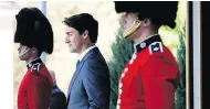  ?? JUSTIN TANG / THE CANADIAN PRESS ?? Prime Minister Justin Trudeau arrives for a press conference following a swearing-in ceremony on Wednesday.