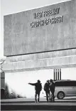  ?? Tom Fox / Dallas Morning News ?? DPS troopers secure the parking lot before a vigil Monday at the West Freeway Church of Christ.