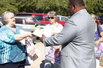  ?? Staff photo by Karl Richter ?? Activist Jo Ann Duman, left, delivers a petition to Charles Jordan, right, constituen­t liaison for U.S. Rep. John Ratcliffe, as Jan Clem, center, and Jodi O’Connell, far right, look on Monday outside Ratcliffe’s office on the campus of Texarkana College.