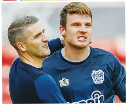  ??  ?? DONE IT! Chris Stokes celebrates his winner with manager Ryan Lowe