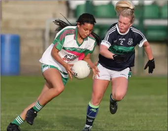  ??  ?? Evelyn Deans from Baltinglas­s looks to go past Bray’s Lauren Rowe. Photo: Joe Byrne