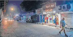  ??  ?? Shops on one side of the road open in Bhandup on Thursday.