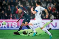  ?? AFP ?? PSG’s forward Kylian Mbappe (left) vies with Caen’s goalkeeper Remy Vercoutre during the French league match. —