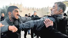  ??  ?? Israeli police scuffle with a protester outside Damascus Gate in Jerusalem’s Old City