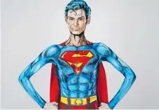  ??  ?? Kay Pike transforms herself using body paint and latex into Superman at her home in Calgary, while live streaming on the Internet.