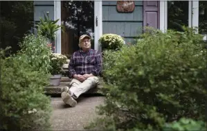  ?? KARSTEN MORAN THE NEW YORK TIMES ?? Bill Jacobs, founder of the St. Kateri Conservati­on Center, outside his house on Long Island, in Wading River, New York in October 2021. A couple’s fight against climate change and for biodiversi­ty starts outside their suburban house.