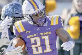  ?? Hans Pennink / Special to the Times Union ?? Ualbany running back Karl Mofor drew a lot of defensive attention in the opener against New Hampshire, gaining 85 yards on 28 carries.