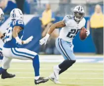  ??  ?? Tennessee Titans running back DeMarco Murray gains yardage against the Indianapol­is Colts in a game this season at Lucas Oil Stadium. Stacy Revere, Getty Images