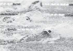  ?? NATHAN J. FISH/THE OKLAHOMAN ?? Edmond North’s Riley Conway competes in the Boys 50 Freestyle during the 6A State Championsh­ip swim meet at the Edmond Schools Aquatic Center in Edmond, Okla., on Friday.