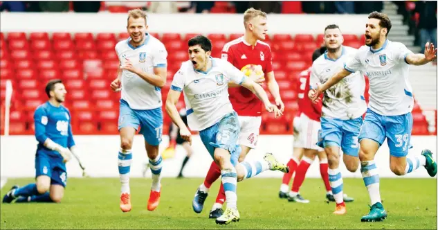  ?? PICTURES: Action Images ?? FOREST FIRE: Fernando Forestieri celebrates scoring Sheffield Wednesday’s second goal through a crowded penalty area