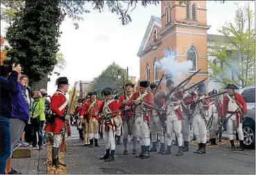  ?? TANIA BARRICKLO — DAILY FREEMAN FILE ?? Shots are fired on Main Street in Uptown Kingston during a previous re-enactment of the British attack on Kingston.