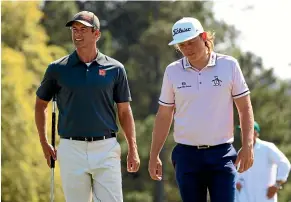  ?? GETTY IMAGES ?? Australian­s Adam Scott, left, and Cameron Smith walk on to the 18th hole during a practice round for the Masters at Augusta National Golf Club.