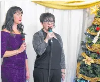  ?? JEREMY FRASER/CAPE BRETON POST ?? Chera Clements, right, and Alexis Lamarche are shown hosting the annual Combined Christmas Giving Telethon and Auction at Rack N’ Roll Billiards in New Waterford on Saturday.