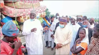  ??  ?? Kebbi State governor consoling victims of the disaster