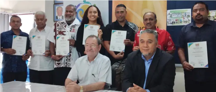  ?? Photo: ?? Fiji National Sports Commission executive chairman Peter Mazey (sitting from left) with director Youth, Sports and Business Developmen­t Philip Heneriko and members of the nine sporting federation­s after receiving their Sports Safe Fiji accreditat­ion at the Ministry of Youth and Sports conference room in Suva on August 6,2020.