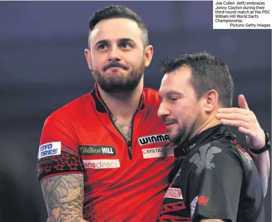  ??  ?? Joe Cullen (left) embraces Jonny Clayton during their third-round match at the PDC William Hill World Darts Championsh­ip.
Picture: Getty Images