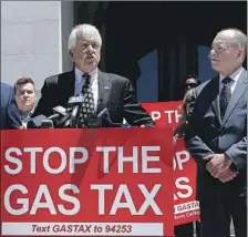  ?? Rich Pedroncell­i Associated Press ?? REPUBLICAN John Cox, speaking in Sacramento on June 18, has made the state’s recent gas tax increase a campaign focus.