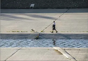  ?? Brian van der Brug Los Angeles Times ?? THE PLAN includes “elevated platform parks” that would stretch nearly a mile over the Rio Hondo and L.A. River, with trees, grass, ponds, horse trails and walking paths. Above, along the river in South Gate in January.