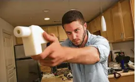  ?? Tribune News Service file photo ?? Cody Wilson showed his first 3D-printed gun in 2013. He is selling the plans, calling a judge’s order “direct knee-capping of the First Amendment.”