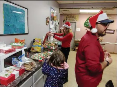  ?? BETSY SCOTT — THE NEWS-HERALD ?? Pastor Mark Winner and his family started the Hope Shoppe at Project Hope in Painesvill­e Township to help provide an opportunit­y for children in need to buy Christmas gifts for loved ones.